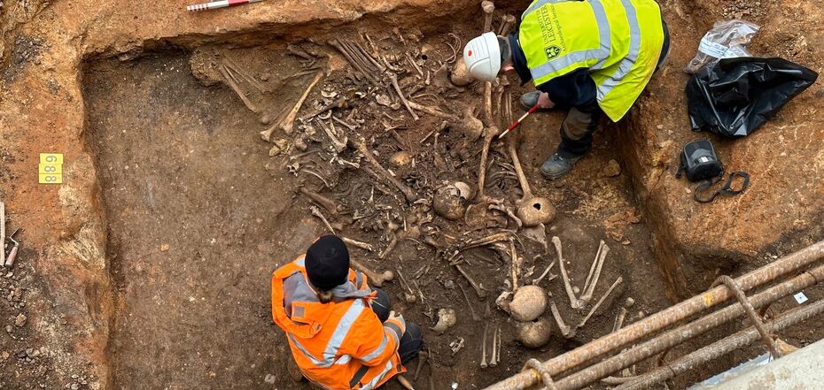 A 12th-century burial site with the bodies of 123 men, women, and children was discovered in England. Photo